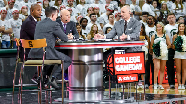 From left, hosts Rece Davis, LaPhonso Ellis, Seth Greenberg and Jay Bilas talk during a broadcast of ESPN college basketball